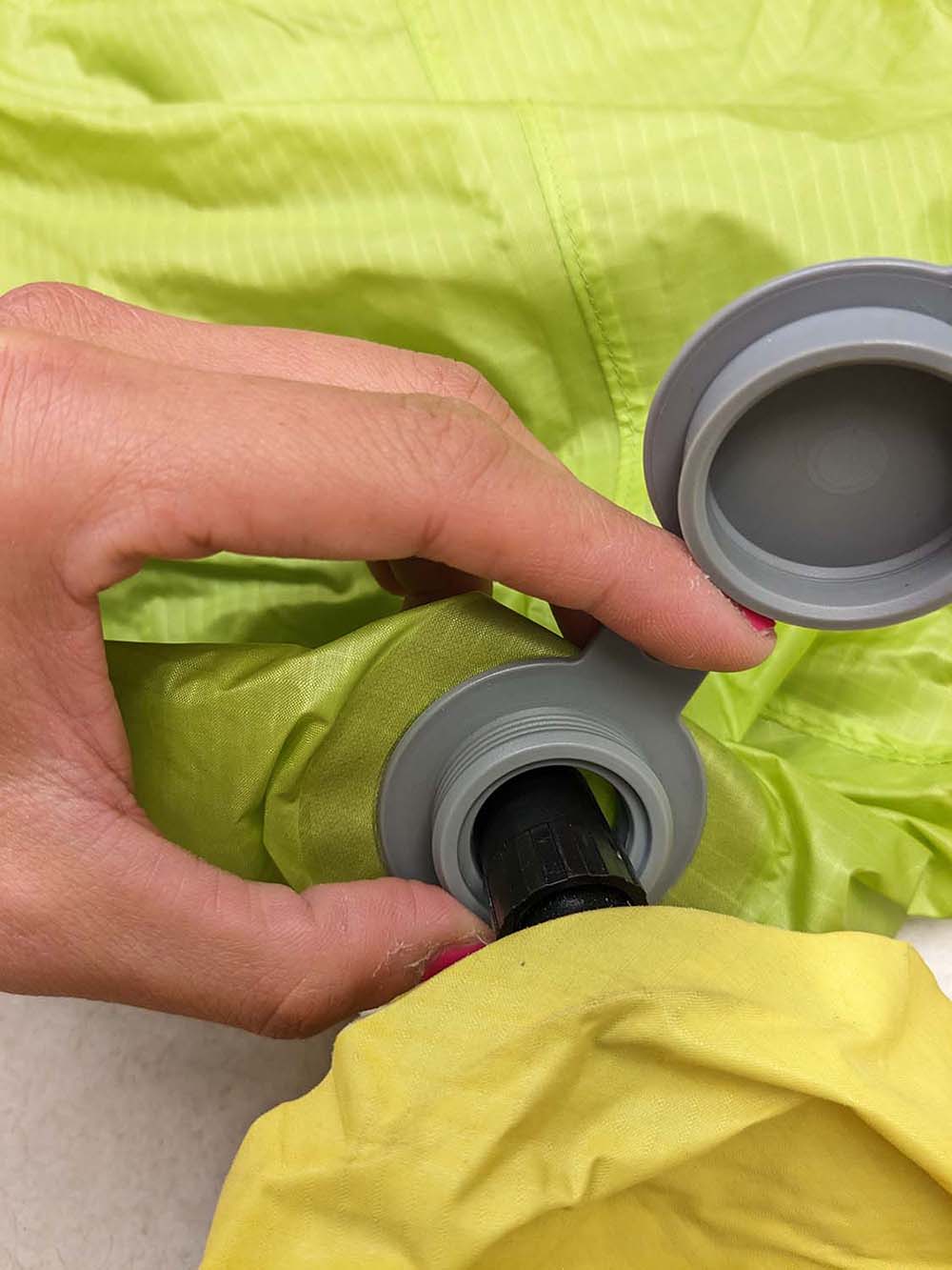 The Xlite valve inserted into the Big Agnes pump sack, with about a centimeter's worth of gap all around it.